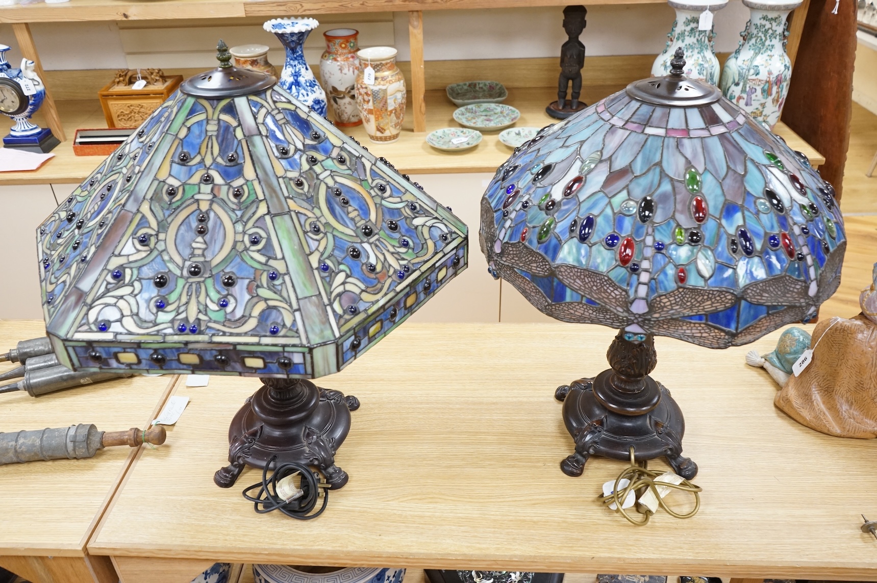 Two Tiffany style table lamps, with ornate glass and metal shades, tallest 72cm high